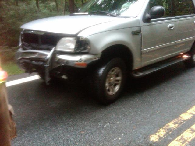 Ford involved in head-on collision. No intrusion into the interior of the SUV.
